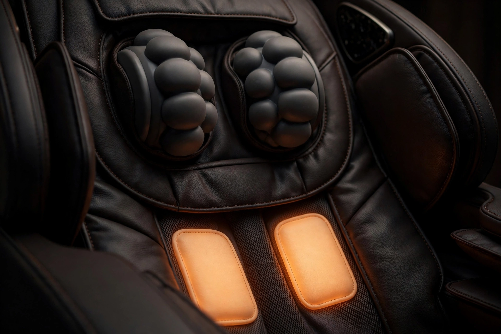 Shiatsu massage chair back rollers with lumbar heat pads glowing warm